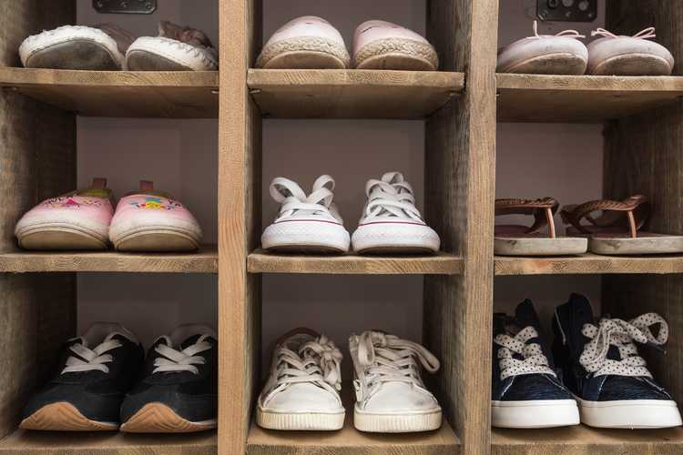 shoe storage rack holding many pairs